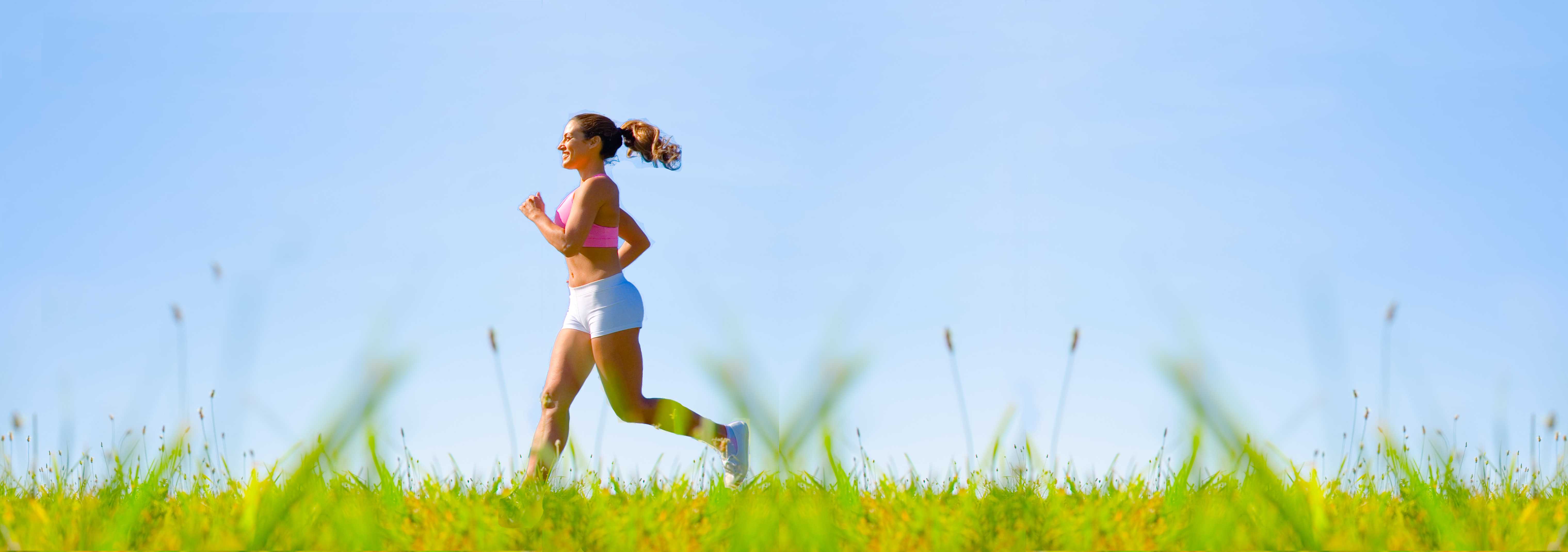 woman jogging across a field